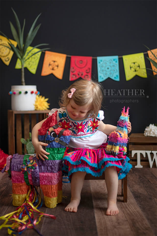 A fun and quirky backdrop featuring tacos and the number two, perfect for celebrating Taco Tuesday