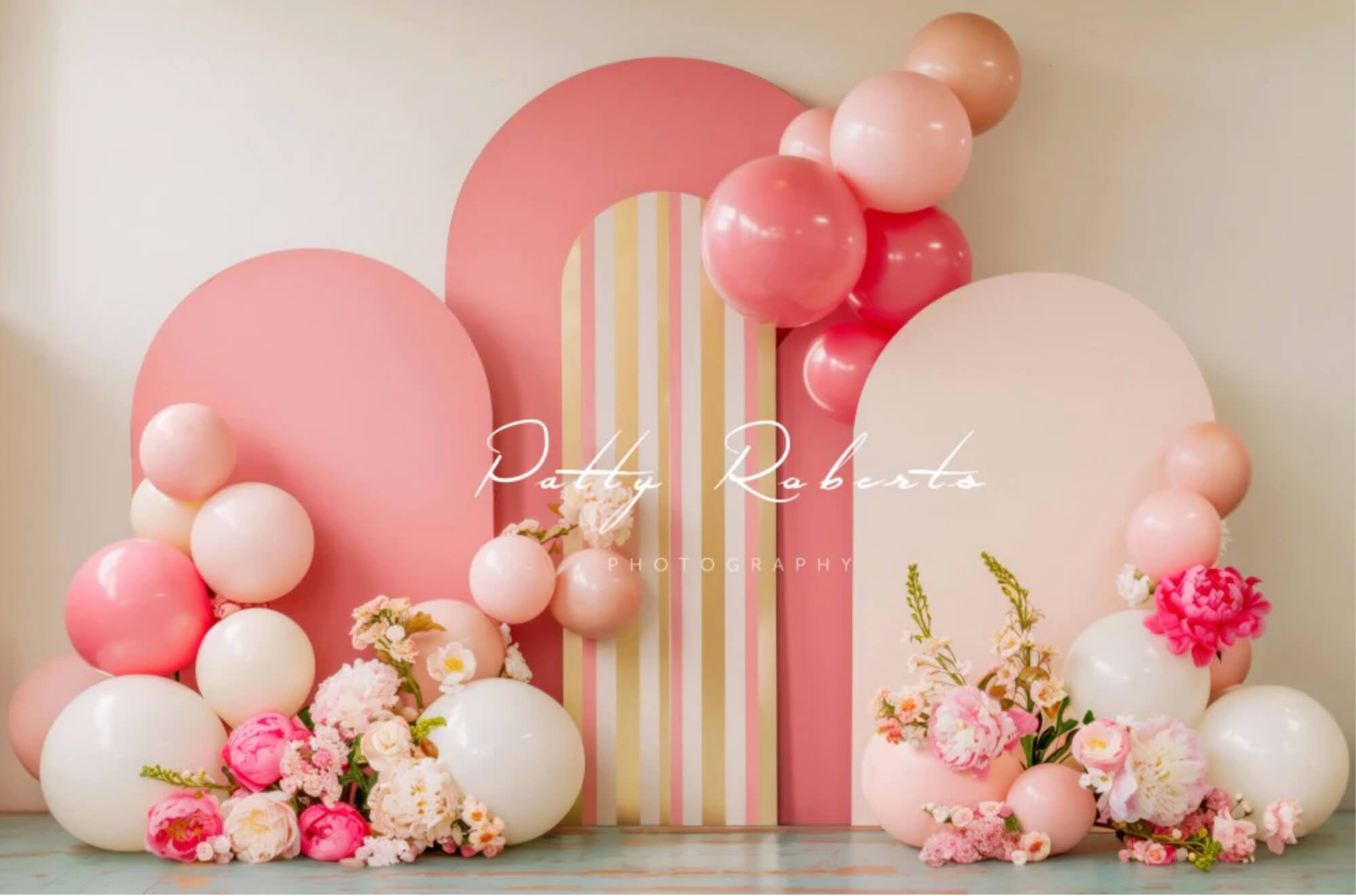 birthday cakes on balloon wall backdrop